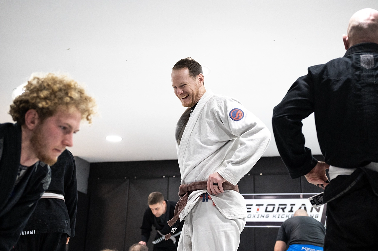 Rob Goodson teaching and supporting students during a Gi Brazilian Jiu Jitsu class at Praetorian MMA