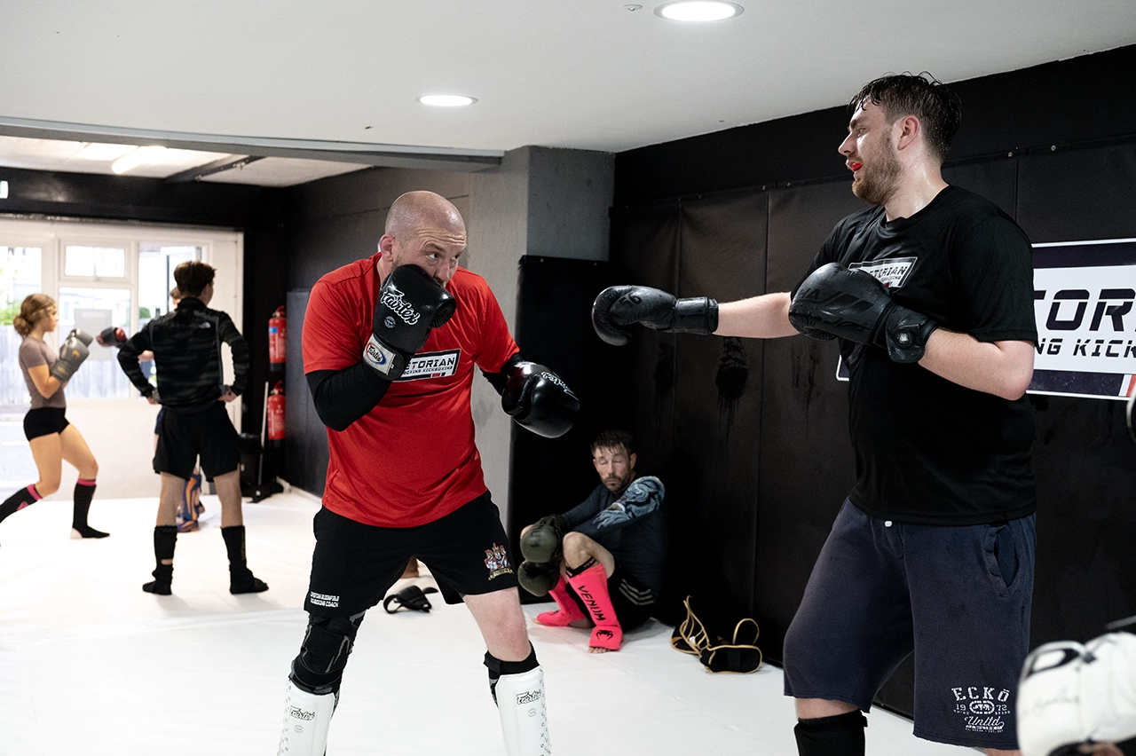 Christian Bloomfield coaching kickboxing students at Praetorian MMA