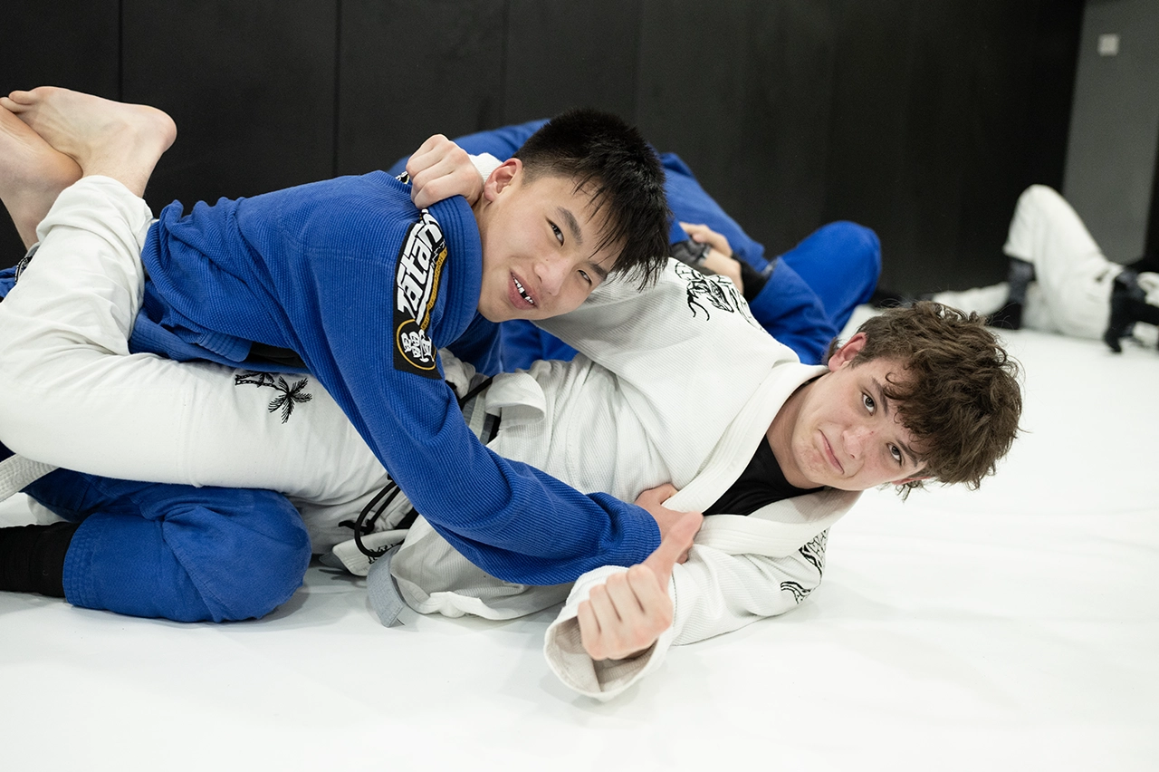Cian Brown training and supporting another student at Praetorian MMA