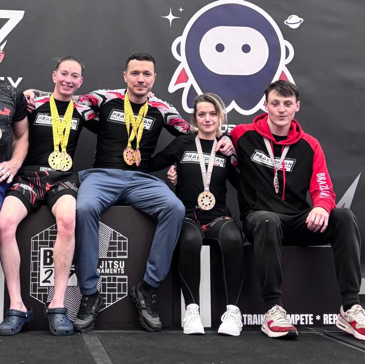 Katie Purnell with teammates following a Brazilian Jiu Jitsu competition